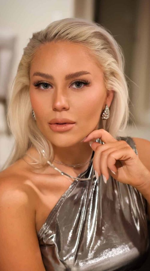 Bronzed glam makeup with sleek blonde hair for an evening event